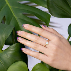 Hand model wearing OPI Bonfire Serenade in a relaxed lifestyle setting