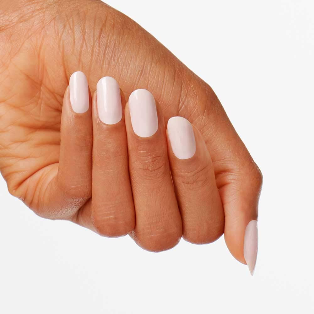 OPI bottle in hands during manicure illustrating easy at-home use