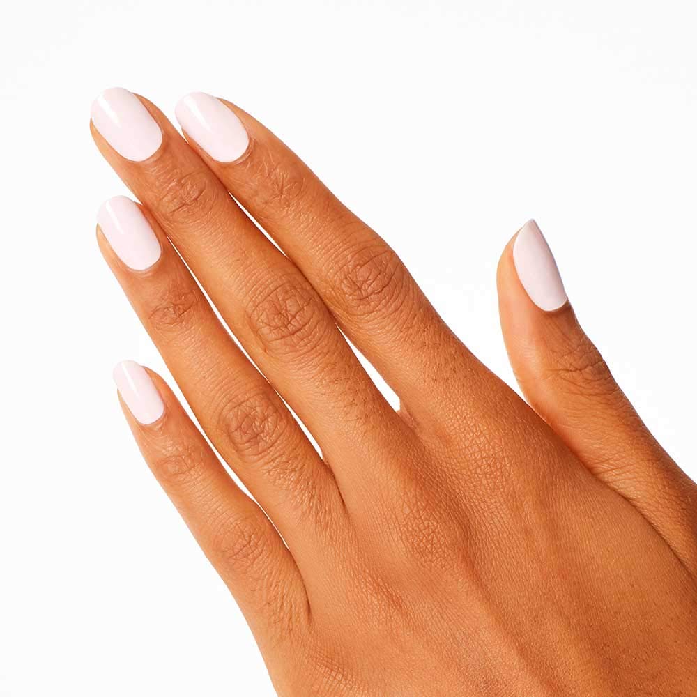 OPI painted nails in a salon setting demonstrating chip-resistant shine