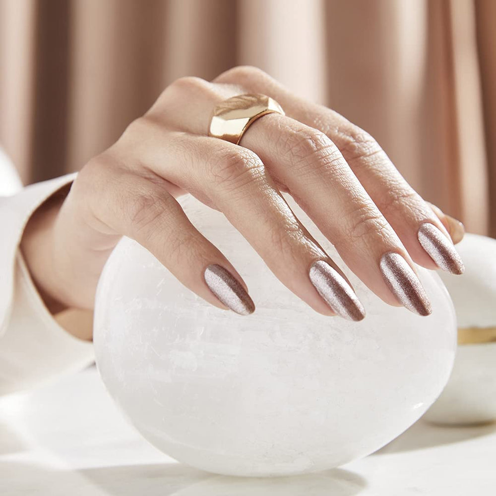 OPI manicured hands wearing metallic composition in a lifestyle setting