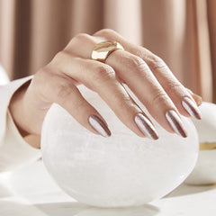 OPI manicured hands wearing metallic composition in a lifestyle setting
