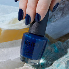 OPI bottle next to ruler showing compact size and easy storage benefit