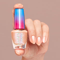 OPI on manicured nails in lifestyle shot showing fast-dry, smudge-resistant soft peach pearl benefit