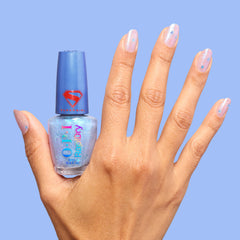 Fingers wearing OPI Cosmic Chic in use to show smudge-resistant glossy look