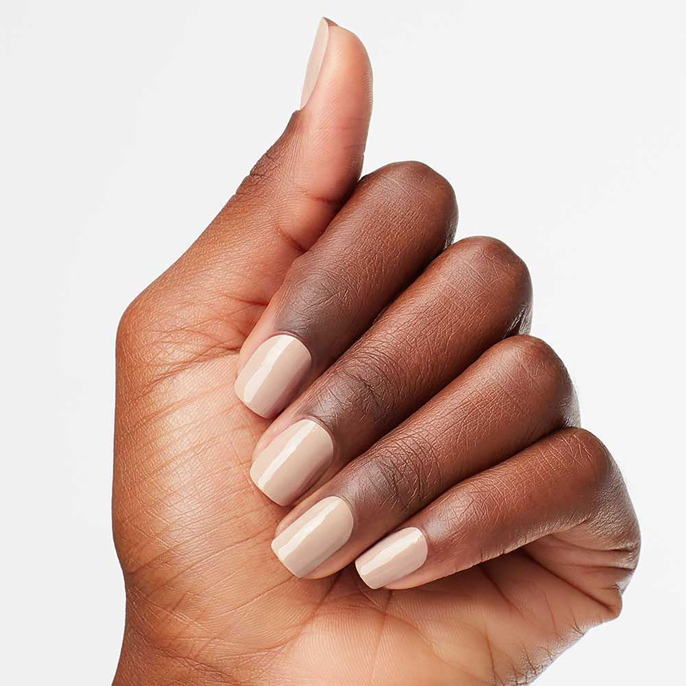 OPI painted nails in lifestyle setting showing chip-resistant, polished look benefit