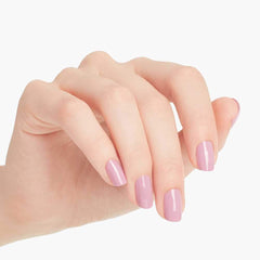 OPI bottle beside hand for scale showing compact professional-sized bottle benefit