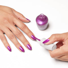 Nail technician applying Thistle Make You Bloom in salon for long-lasting wear