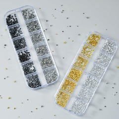 OPMADM precision tweezer picking up a stud for accurate placement and cleaner application