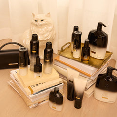 Oribe Balm D'Or on bathroom shelf evoking luxe routine and salon-quality scent