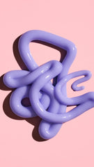 Oribe bright blonde conditioner creamy violet texture on hand, helps tone brassiness