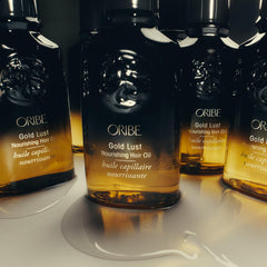 Oribe Gold Lust Oil with argan and jasmine ingredients illustrating restorative benefits