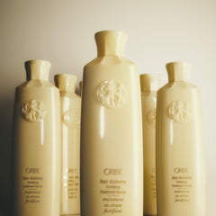 Oribe lifestyle bathroom shelf display evoking premium routine and sensory appeal