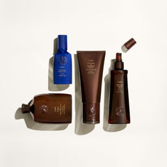 Oribe shampoo in shower being applied for lifted hair