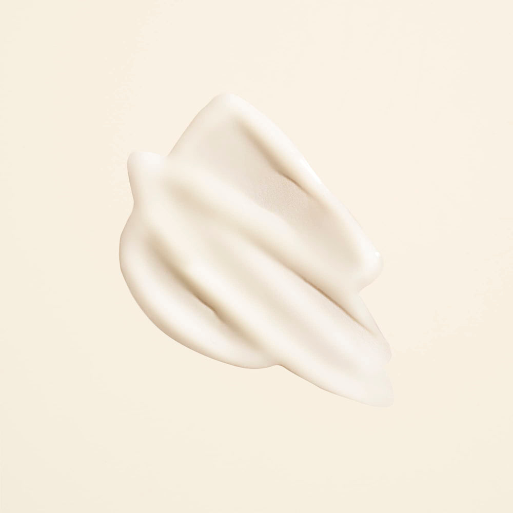 Oribe Matte Waves being applied to damp hair to create beachy waves