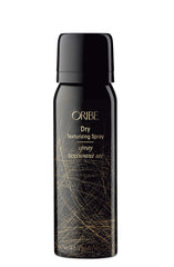 ORIBE products grouped on bathroom shelf suggesting salon results and everyday luxury benefit