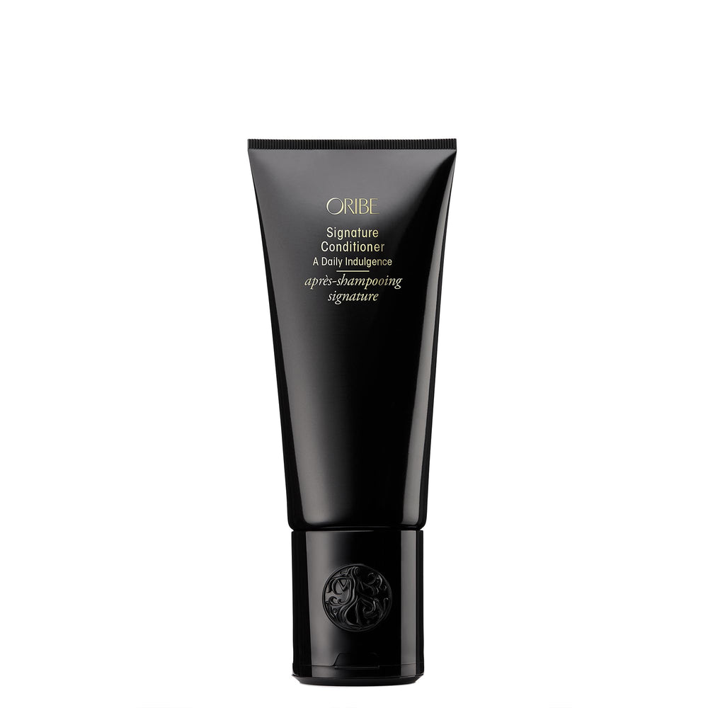 Oribe signature conditioner front bottle showing premium packaging and brand benefit