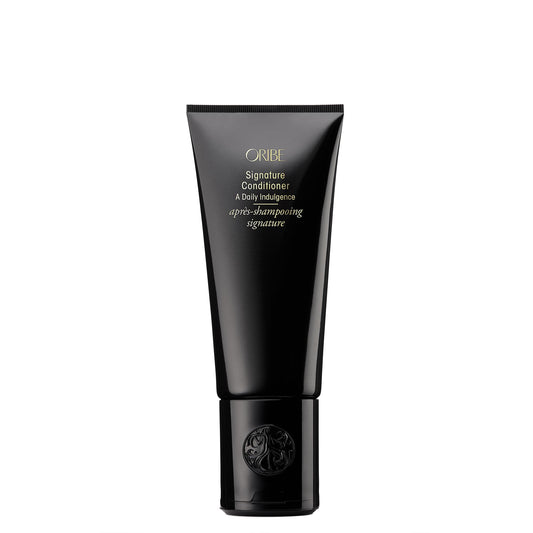 Oribe signature conditioner front bottle showing premium packaging and brand benefit
