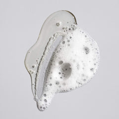 Oribe signature shampoo creamy lather close-up demonstrating gentle cleansing benefit