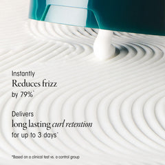 Oribe cream applied to palms demonstrating easy distribution and slip