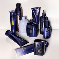 Oribe Supershine Light on bathroom shelf in lifestyle setting suggesting daily use