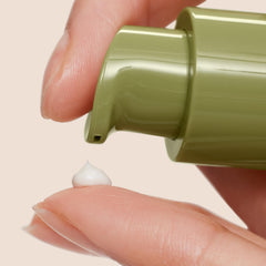 Origins Plantscription cream being applied with finger demonstrating gentle under-eye use