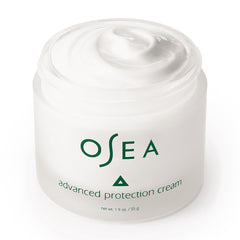 OSEA 1oz jar next to coin showing compact travel-friendly size benefit