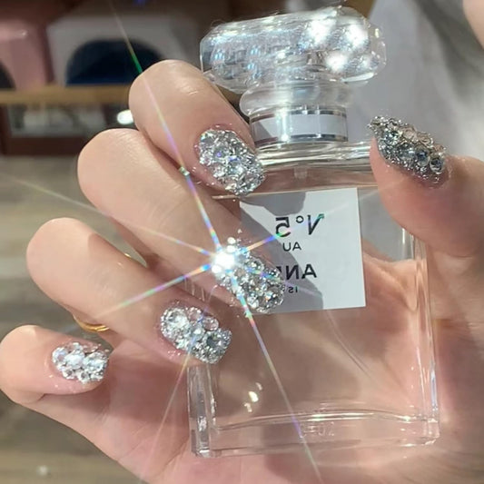 OSTTMA front packaging showing 24 glitter press-on nails and stickers for quick glam