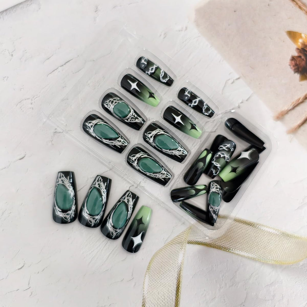 OSTTMA press-on nails worn on hands with dark outfit demonstrating finished look