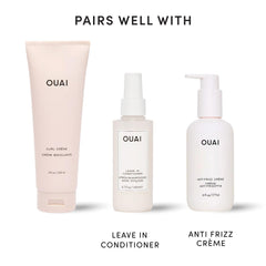 OUAI next to hand for size comparison showing the 8 oz product scale