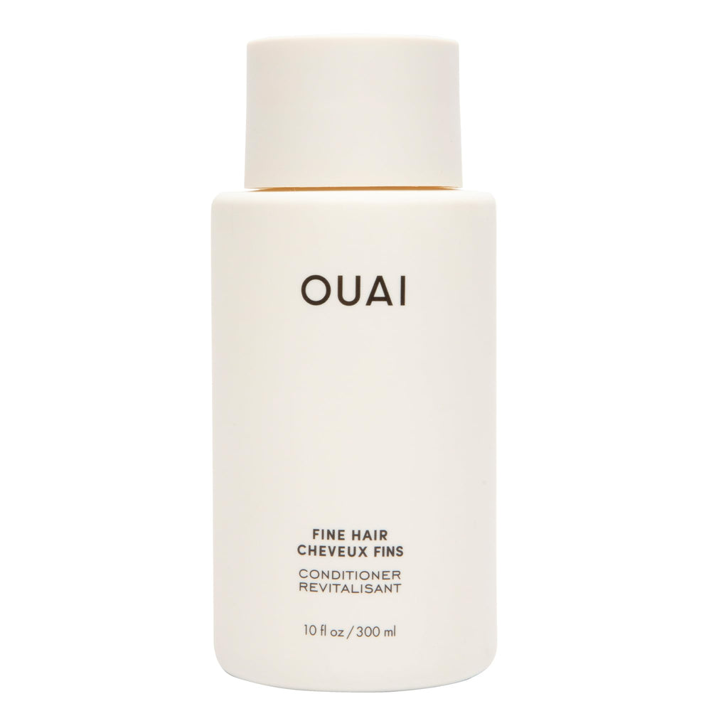 OUAI bottle front view showing branding and lightweight volumizing benefit
