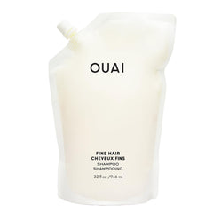OUAI bottle front view showing 32 oz refill and clear label benefits