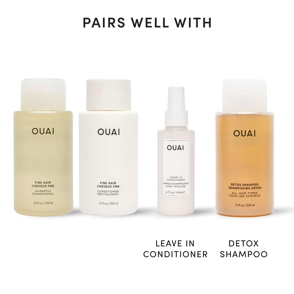 OUAI 10 fl oz bottle next to ruler showing true size