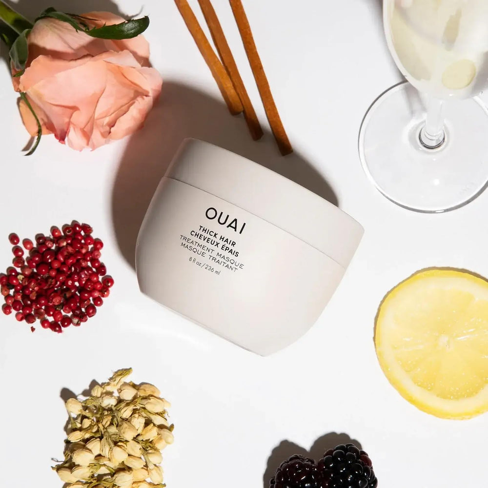 OUAI product next to everyday items indicating 8 fl oz size
