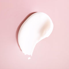 Ouidad Advanced Climate Control shampoo bottle close-up for gentle cleansing