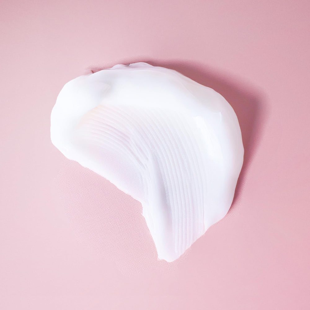Ouidad on color-treated curls showing glossy, protected, frizz-minimized finish