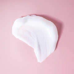 Ouidad on color-treated curls showing glossy, protected, frizz-minimized finish