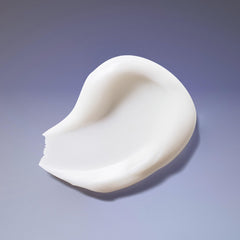 Applying Ouidad conditioner to tight curls for improved manageability