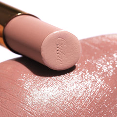 Oulac lip application closeup on model demonstrates satin matte finish benefit