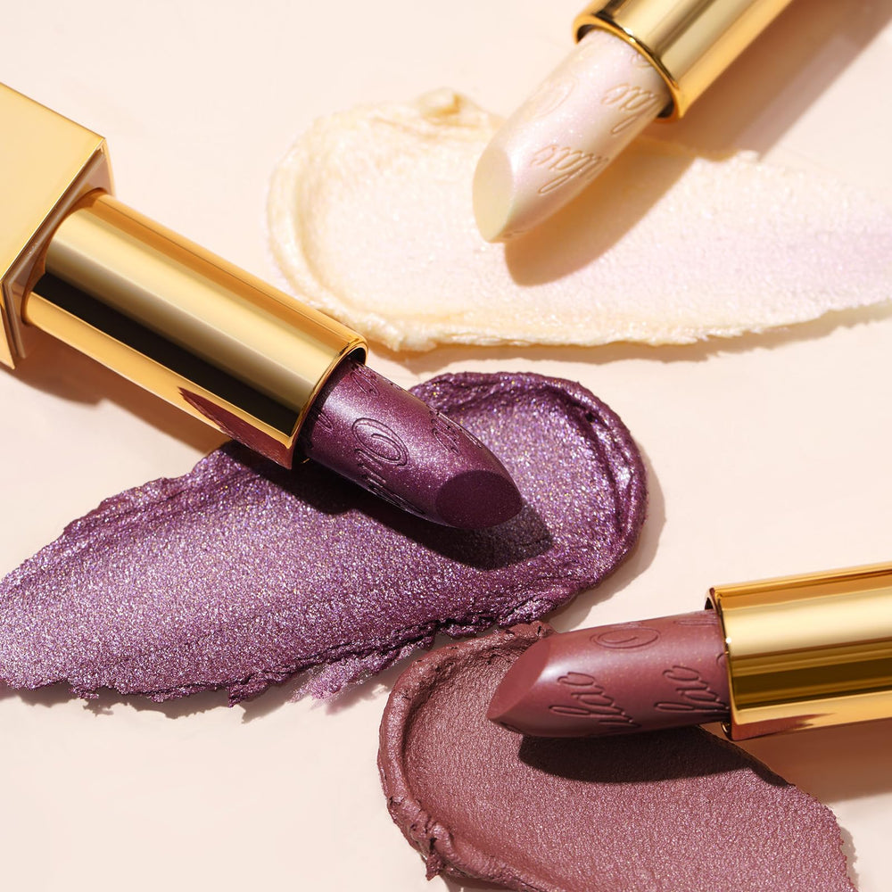 Oulac lipstick next to makeup bag in lifestyle scene for ready-to-go glamour