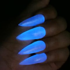 Oumisaya gel on a nail being cured under UV lamp, illustrating fast curing and professional finish