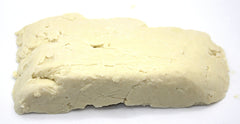 Our Earth's Secrets melted shea butter being mixed into salve, shows formulation ease