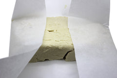Our Earth's Secrets 10 lb block next to ruler for scale, illustrates large quantity
