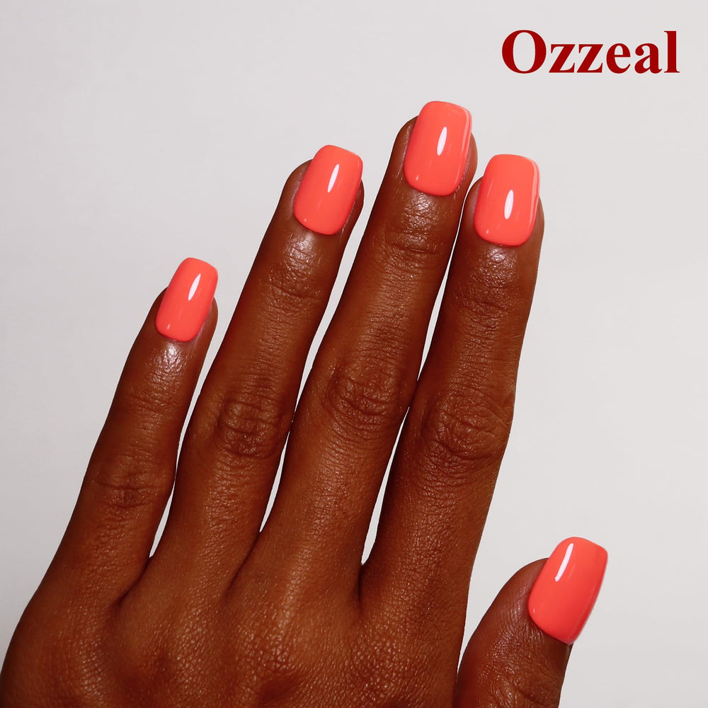 Ozzeal color swatch on sample tip showing vibrant coral payoff for styling choices