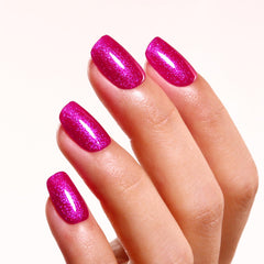 Ozzeal swatches on hand showcasing pearlescent glitter and salon finish