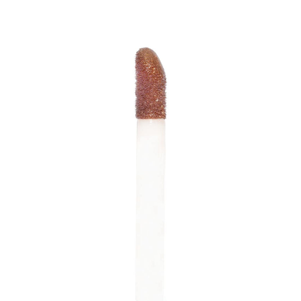 Palladio swatch on skin revealing sheer bronze color and hydration