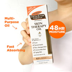 Palmer's oil being smoothed onto arm for softer, smoother skin