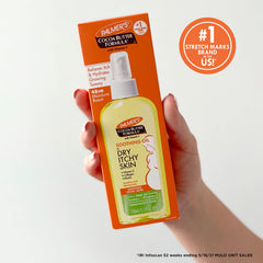 Palmer's being applied to an arm to soothe dry itchy skin