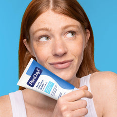 PanOxyl creamy wash lathered in hand showing easy application and deep-clean benefit