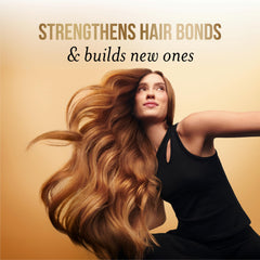 Pantene applied to damp hair in hand demonstrating quick absorption and detangling