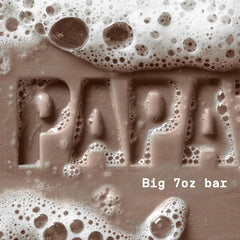 PAPATUI bar soap on shower shelf illustrating proper drainage for longer life